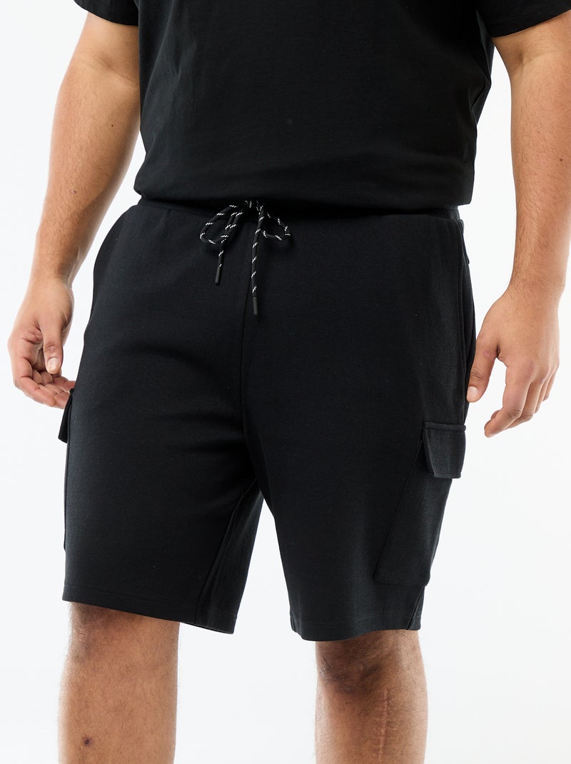 Bermuda em malha piqué com bolsos de aba Preto - Kiabi