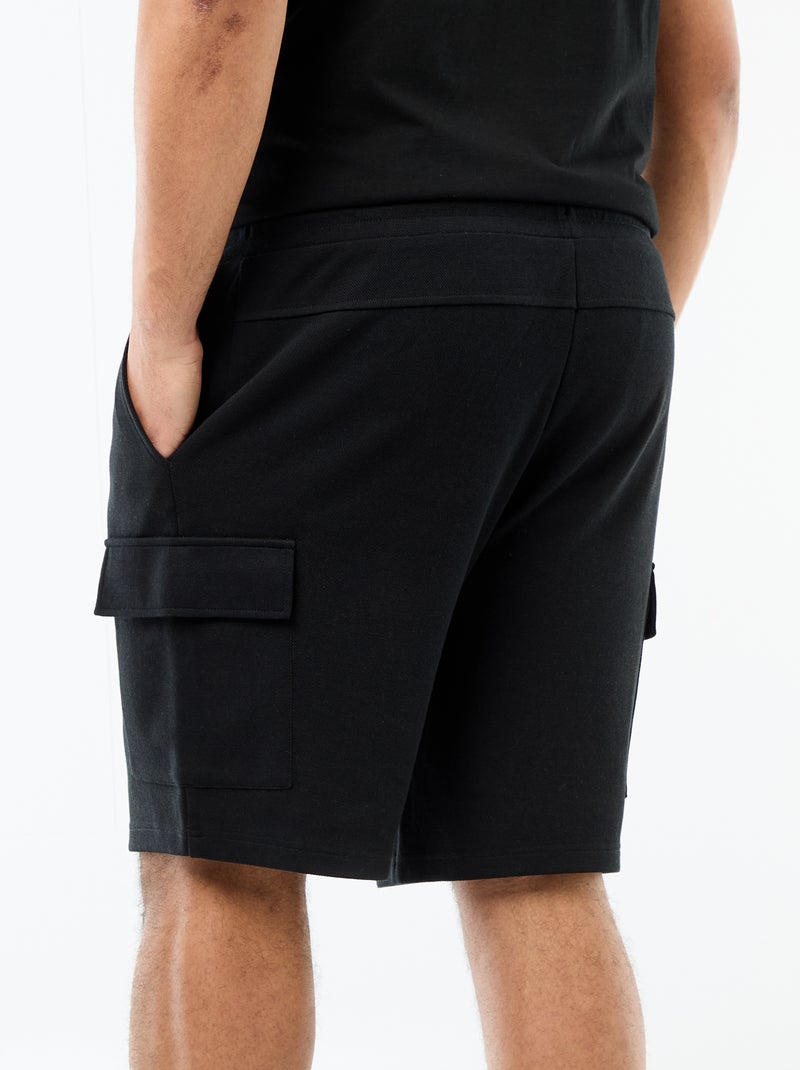 Bermuda em malha piqué com bolsos de aba Preto - Kiabi