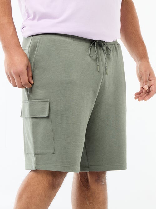 Bermuda em malha piqué com bolsos de aba - Kiabi