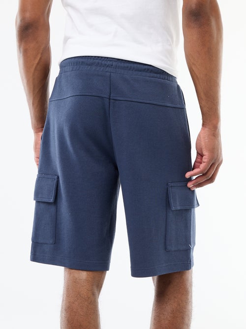 Bermuda em piqué de algodão com múltiplos bolsos - Kiabi Bermuda em piqué de algodão com múltiplos bolsos - Kiabi