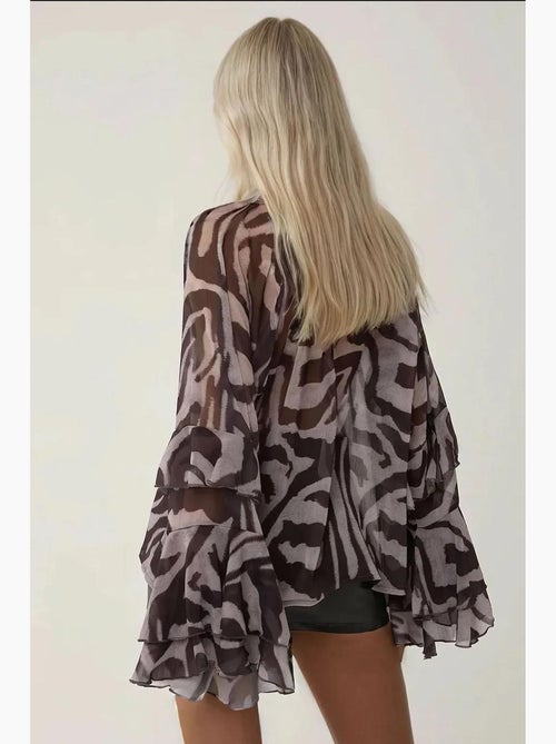 Blusa com detalhe de folhos e estampado de zebra hiccup - Kiabi Blusa com detalhe de folhos e estampado de zebra hiccup - Kiabi