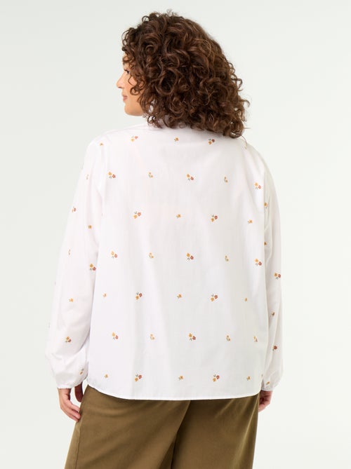 Blusa com flores bordadas e gola alta - Kiabi Blusa com flores bordadas e gola alta - Kiabi