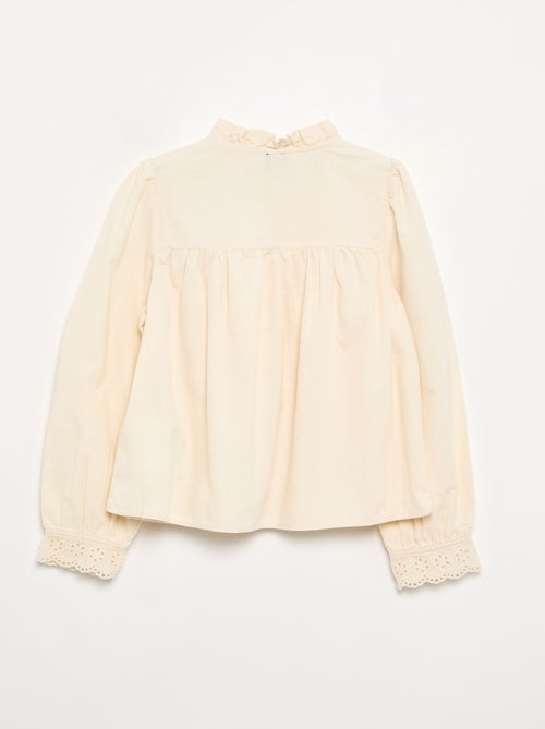 Blusa com punhos bordados e gola com folhos - Kiabi
