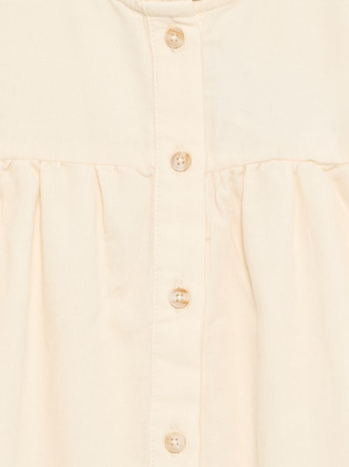 Blusa com punhos bordados e gola com folhos - Kiabi