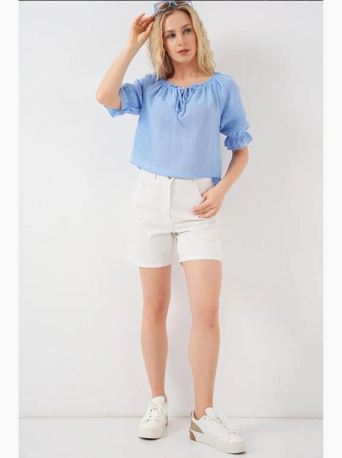 Blusa curta texturizada decote barco detalhe pompons bdart - Kiabi Blusa curta texturizada decote barco detalhe pompons bdart - Kiabi