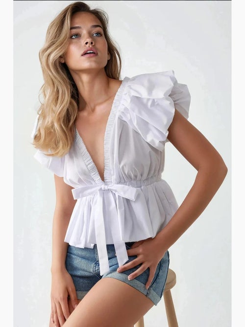 Blusa de algodão justa com detalhe de laço hiccup - Kiabi Blusa de algodão justa com detalhe de laço hiccup - Kiabi