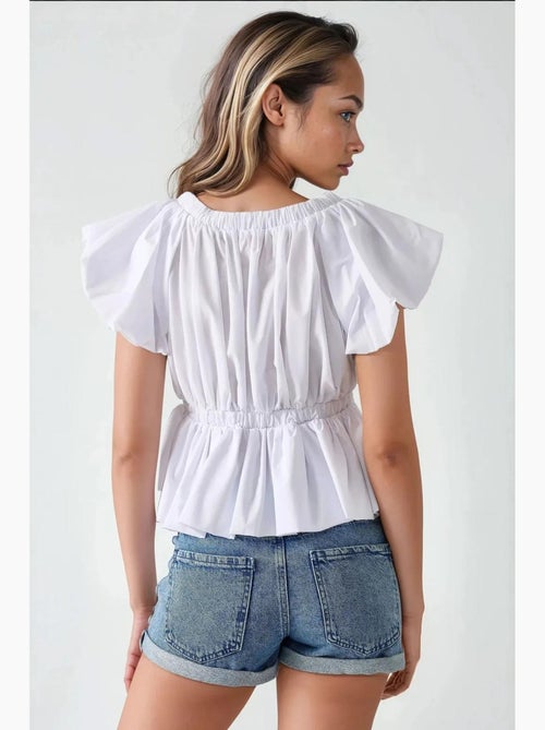 Blusa de algodão justa com detalhe de laço hiccup - Kiabi Blusa de algodão justa com detalhe de laço hiccup - Kiabi