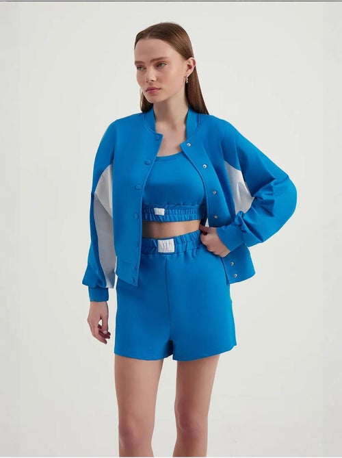 Blusa de fato de treino com botões e gola alta em blocos de cor - Kiabi Blusa de fato de treino com botões e gola alta em blocos de cor - Kiabi