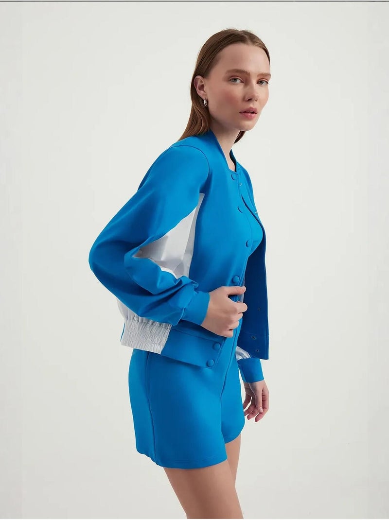 Blusa de fato de treino com botões e gola alta em blocos de cor Azul - Kiabi