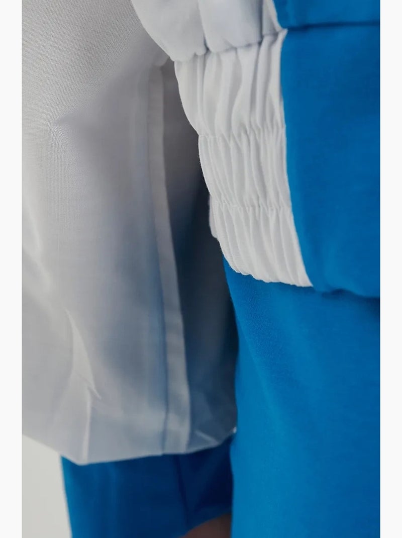 Blusa de fato de treino com botões e gola alta em blocos de cor hiccup Azul - Kiabi