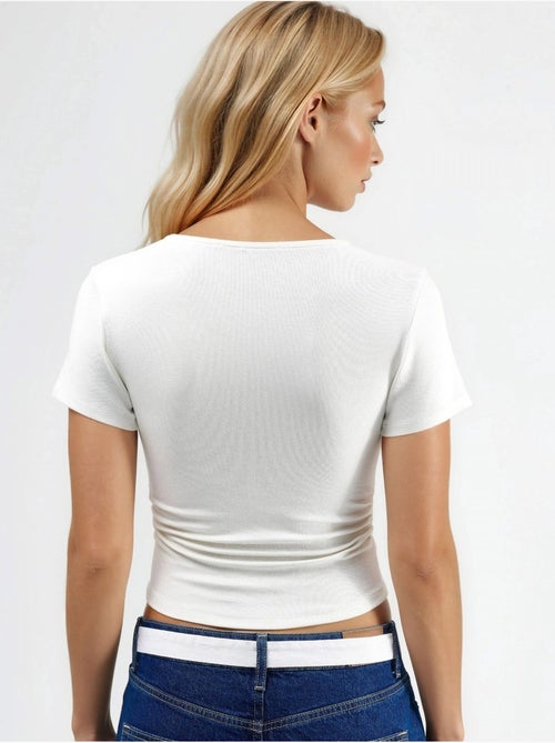 Blusa de malha elástica justa com detalhe drapeado hiccup - Kiabi Blusa de malha elástica justa com detalhe drapeado hiccup - Kiabi