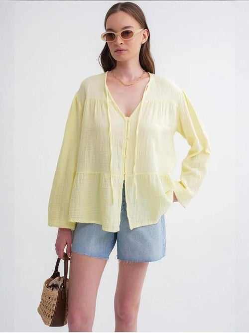 Blusa de manga comprida de corte descontraído com laço no decote mixray - Kiabi Blusa de manga comprida de corte descontraído com laço no decote mixray - Kiabi