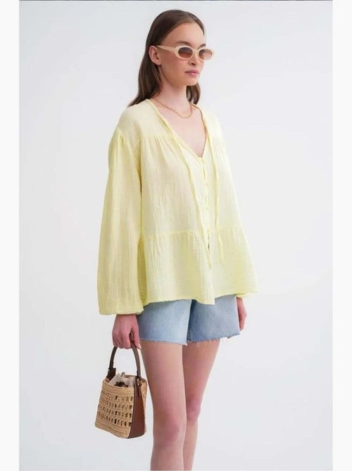 Blusa de manga comprida de corte descontraído com laço no decote mixray - Kiabi Blusa de manga comprida de corte descontraído com laço no decote mixray - Kiabi