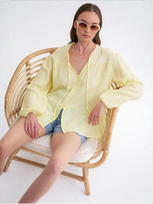 Blusa de manga comprida de corte descontraído com laço no decote mixray - Kiabi Blusa de manga comprida de corte descontraído com laço no decote mixray - Kiabi