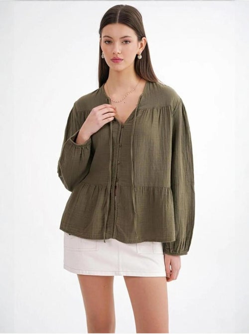 Blusa de manga comprida de corte descontraído com laço no decote mixray - Kiabi Blusa de manga comprida de corte descontraído com laço no decote mixray - Kiabi