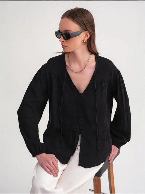 Blusa de manga comprida de corte descontraído com laço no decote mixray - Kiabi Blusa de manga comprida de corte descontraído com laço no decote mixray - Kiabi