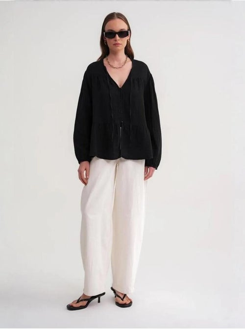 Blusa de manga comprida de corte descontraído com laço no decote mixray - Kiabi Blusa de manga comprida de corte descontraído com laço no decote mixray - Kiabi