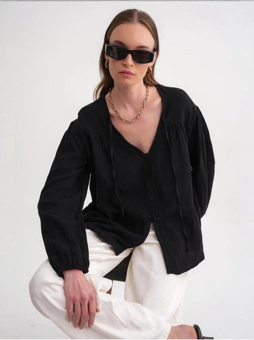 Blusa de manga comprida de corte descontraído com laço no decote mixray - Kiabi Blusa de manga comprida de corte descontraído com laço no decote mixray - Kiabi