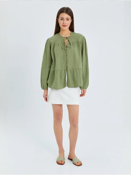 Blusa de manga comprida de corte descontraído com laço no decote mixray - Kiabi Blusa de manga comprida de corte descontraído com laço no decote mixray - Kiabi