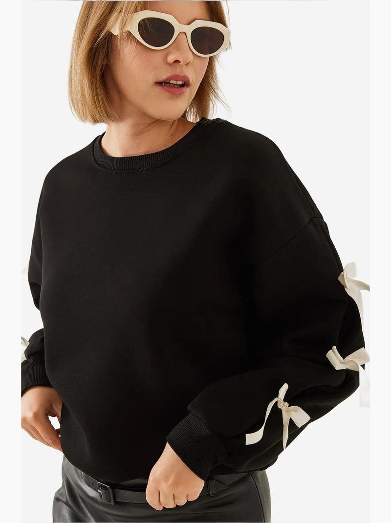 Blusa de moletom escovada de três fios com mangas de laço lucci Preto - Kiabi