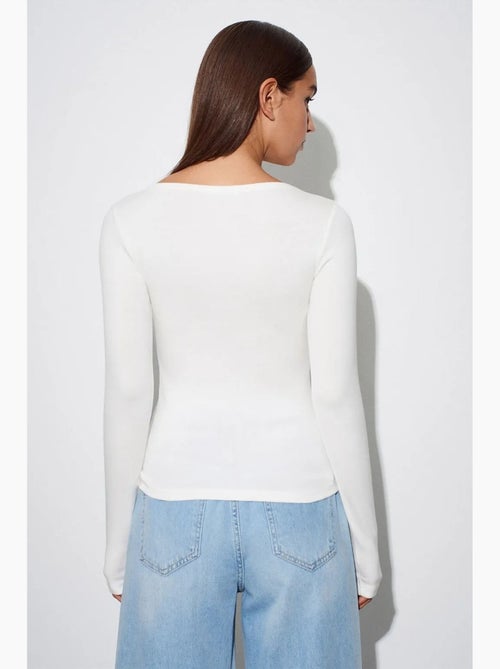 Blusa de mulher slim fit com decote barco e manga comprida dilvin - Kiabi Blusa de mulher slim fit com decote barco e manga comprida dilvin - Kiabi