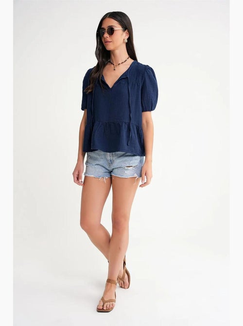 Blusa de musselina texturizada com decote redondo e viés mixray - Kiabi Blusa de musselina texturizada com decote redondo e viés mixray - Kiabi