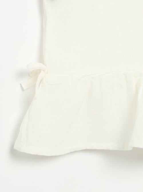 Blusa peplum com laços fantasia - Kiabi