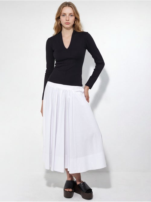 Blusa slim de manga comprida com decote em v busem - Kiabi Blusa slim de manga comprida com decote em v busem - Kiabi
