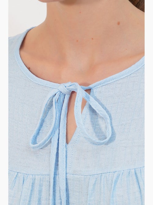 Blusa texturizada nó frontal bdart - Kiabi Blusa texturizada nó frontal bdart - Kiabi