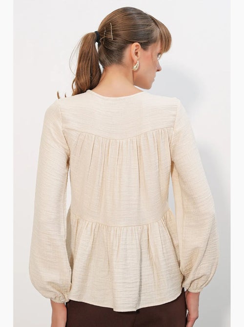 Blusa texturizada nó frontal bdart - Kiabi Blusa texturizada nó frontal bdart - Kiabi