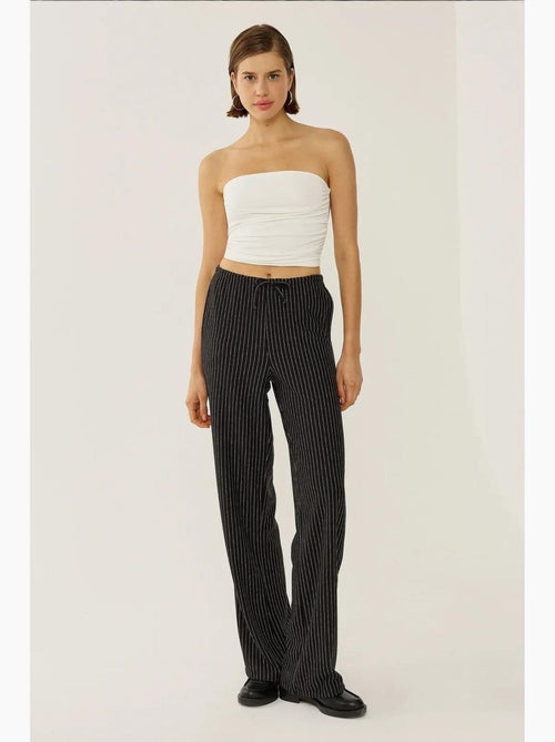 Calça às riscas com cós elástico hiccup - Kiabi Calça às riscas com cós elástico hiccup - Kiabi