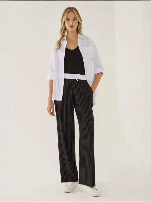 Calça às riscas com cós elástico - Kiabi Calça às riscas com cós elástico - Kiabi