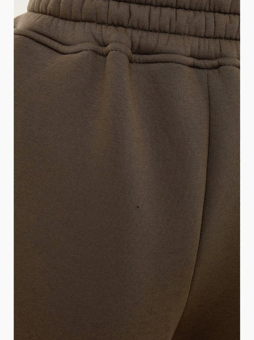 Calça de fato de treino básica com cós elástico hiccup - Kiabi Calça de fato de treino básica com cós elástico hiccup - Kiabi