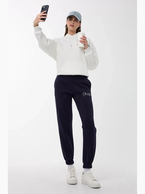 Calça de fato de treino com cós elástico hiccup - Kiabi Calça de fato de treino com cós elástico hiccup - Kiabi