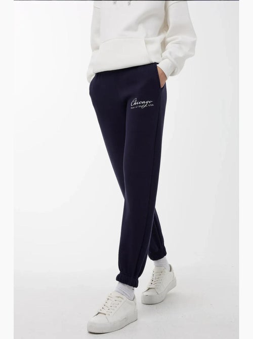 Calça de fato de treino com cós elástico hiccup - Kiabi Calça de fato de treino com cós elástico hiccup - Kiabi