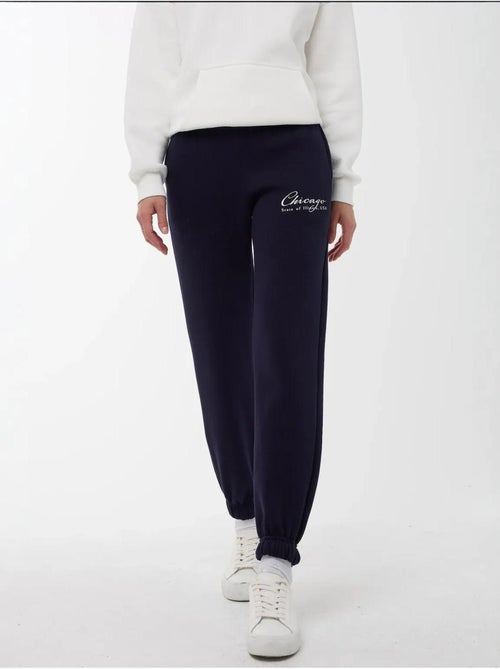 Calça de fato de treino com cós elástico hiccup - Kiabi Calça de fato de treino com cós elástico hiccup - Kiabi