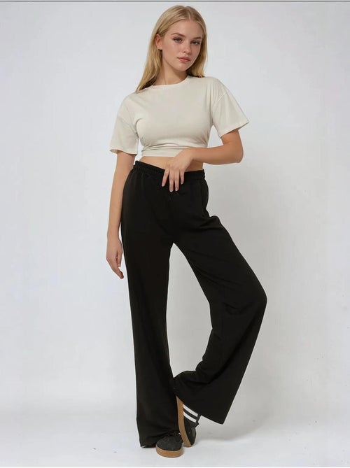 Calça de fato de treino elástica de perna larga hiccup - Kiabi Calça de fato de treino elástica de perna larga hiccup - Kiabi