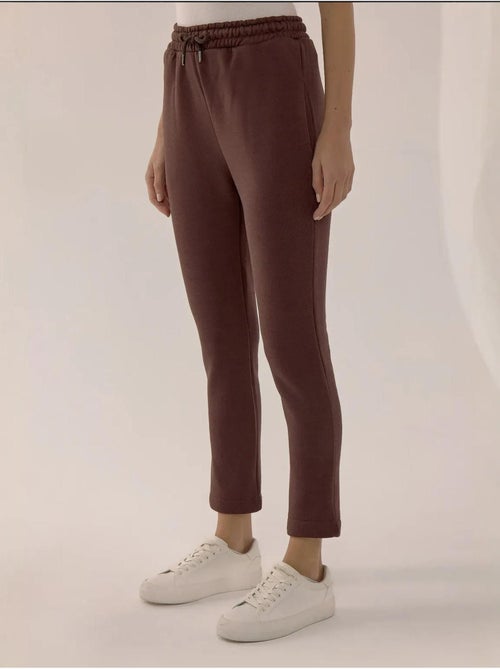 Calça de fato de treino slim fit com cordão hiccup - Kiabi Calça de fato de treino slim fit com cordão hiccup - Kiabi