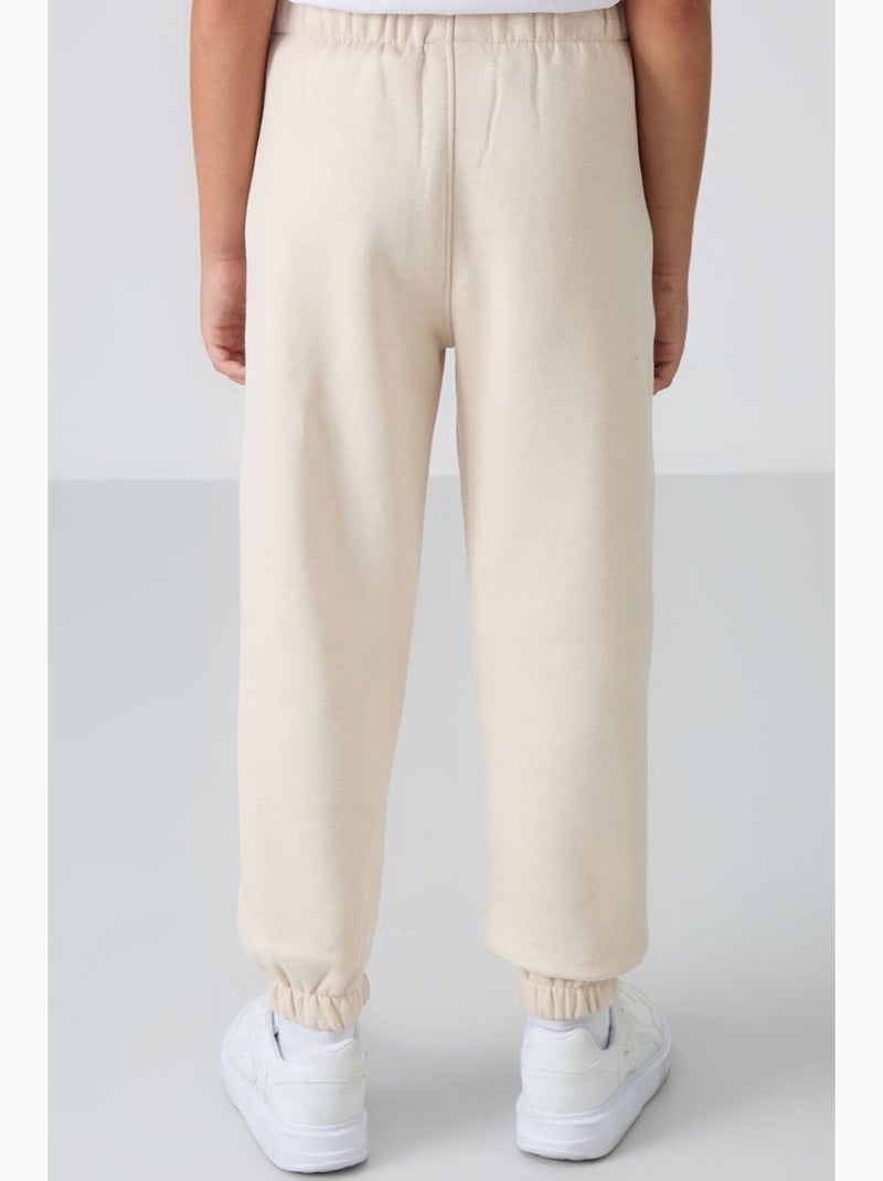 Calça de moletom infantil tommy Preto Bege - Kiabi