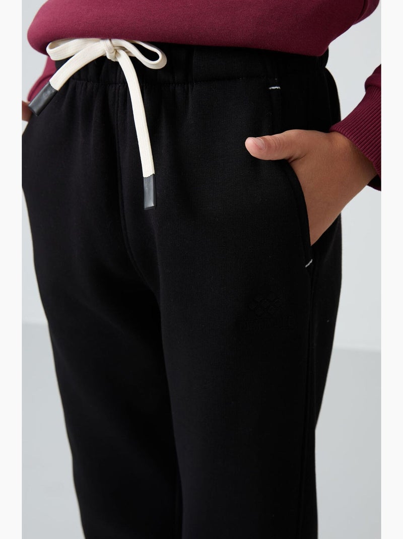 Calça de moletom infantil tommy Preto - Kiabi