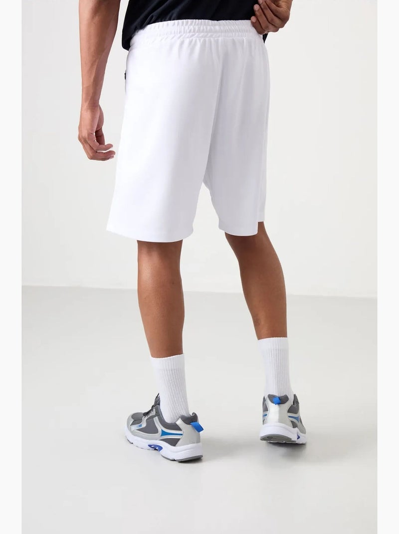 Calção jogging liso em malha tommy Branco - Kiabi
