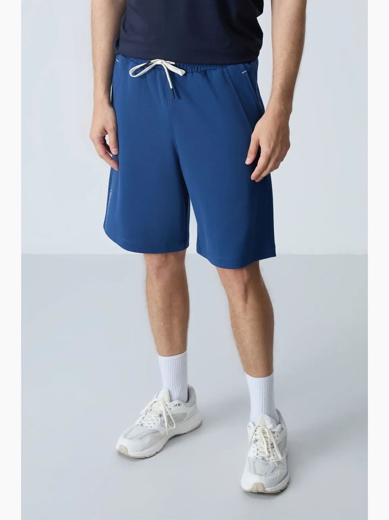 Calção jogging mistura de algodão tommy Azul - Kiabi