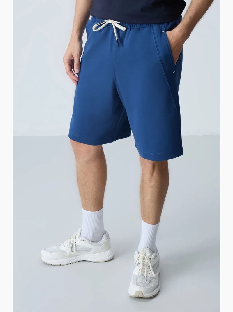Calção jogging mistura de algodão tommy Azul - Kiabi