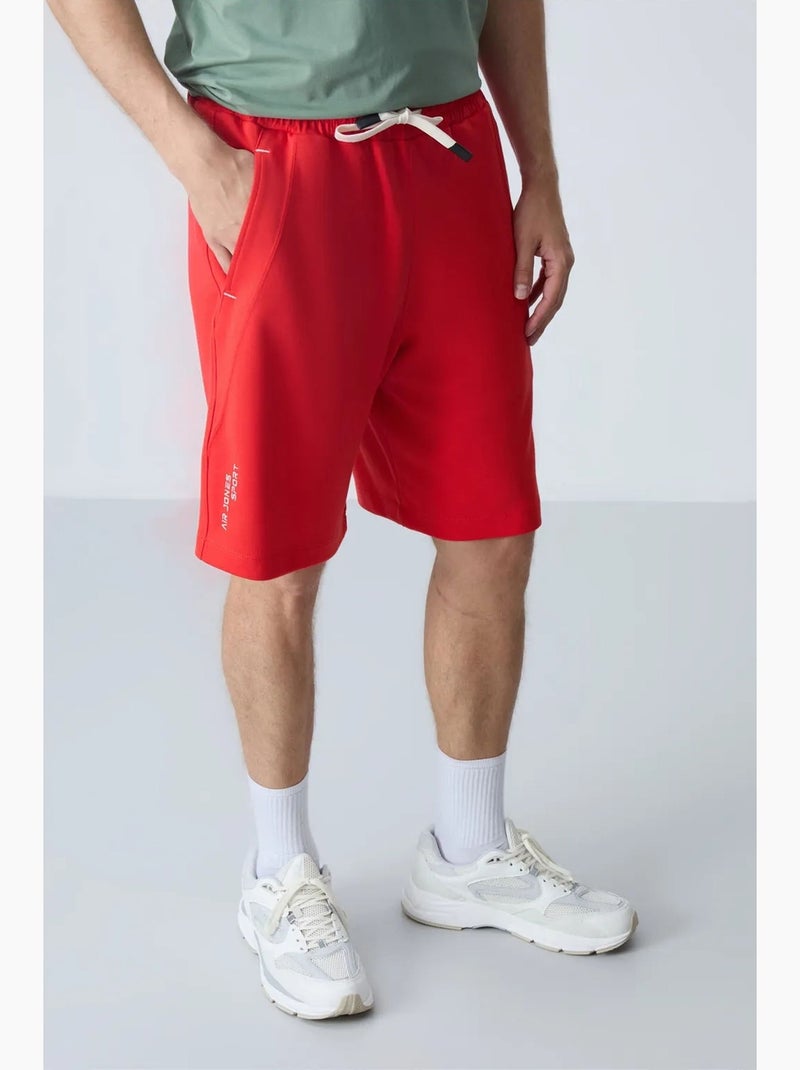 Calção jogging mistura de algodão tommy Vermelho - Kiabi