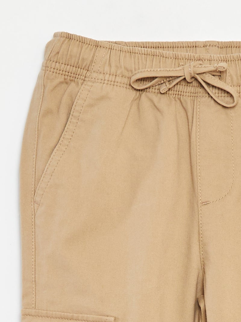 Calças com bolsos e cós ajustável Bege - Kiabi