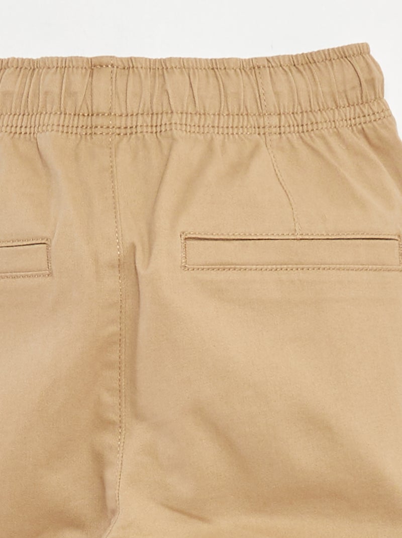Calças com bolsos e cós ajustável Bege - Kiabi