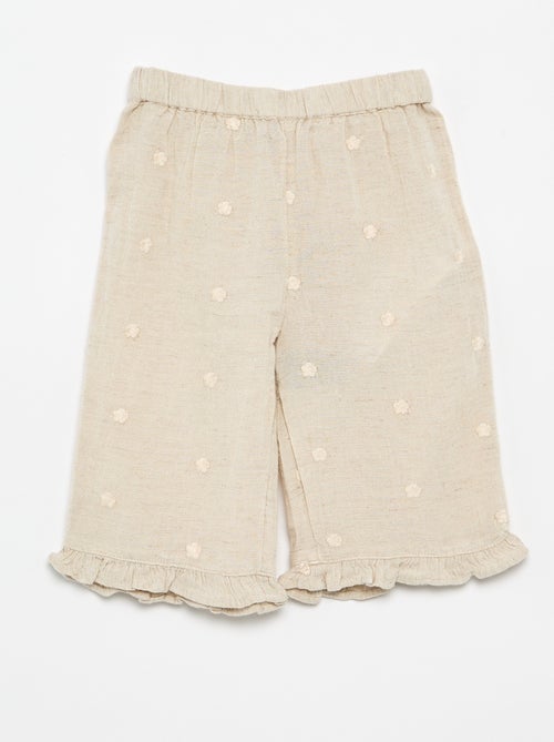 Calças com bordados de flores - Kiabi