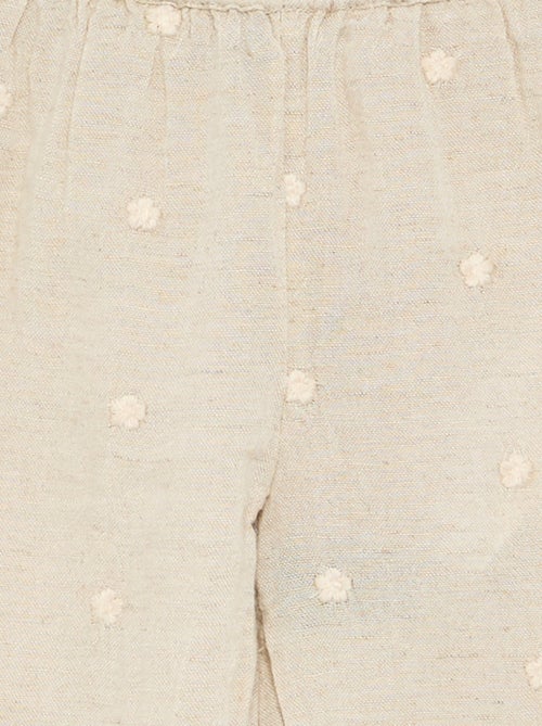 Calças com bordados de flores - Kiabi