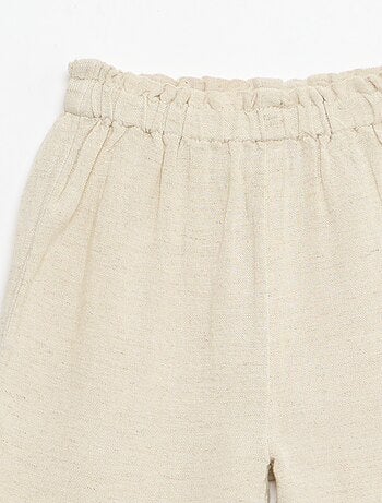 Calças com folhos na bainha