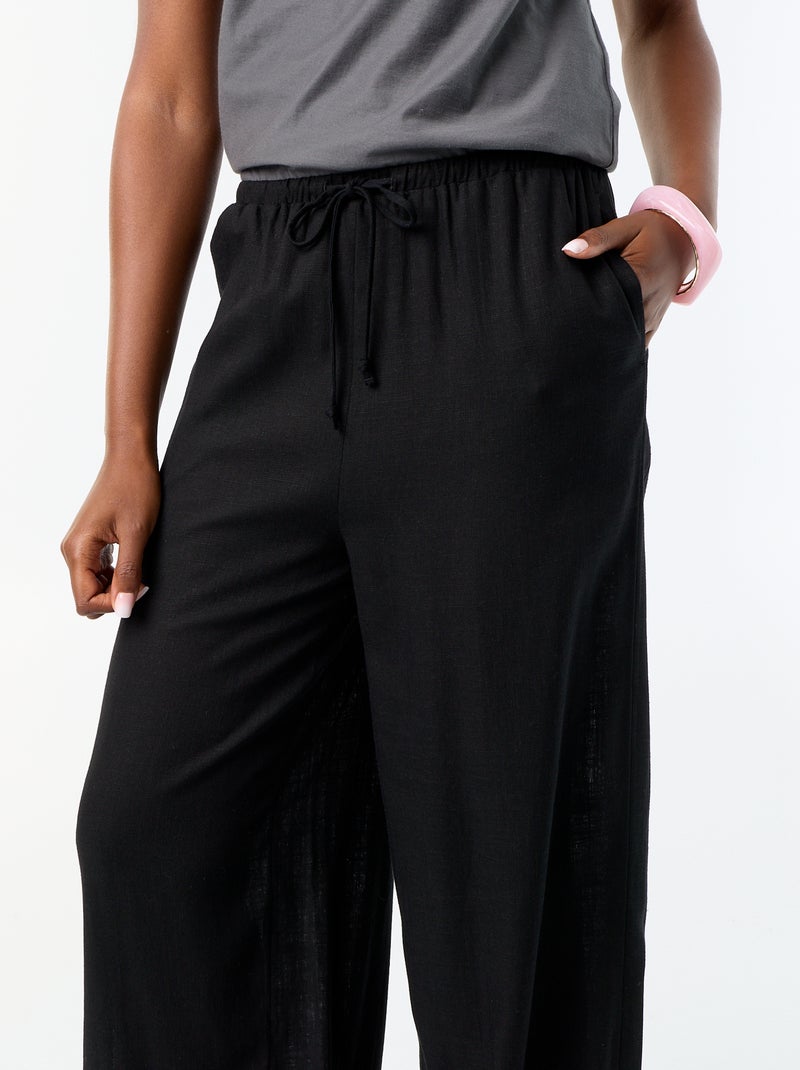 Calças de corte balão lisas com 2 bolsos Preto - Kiabi